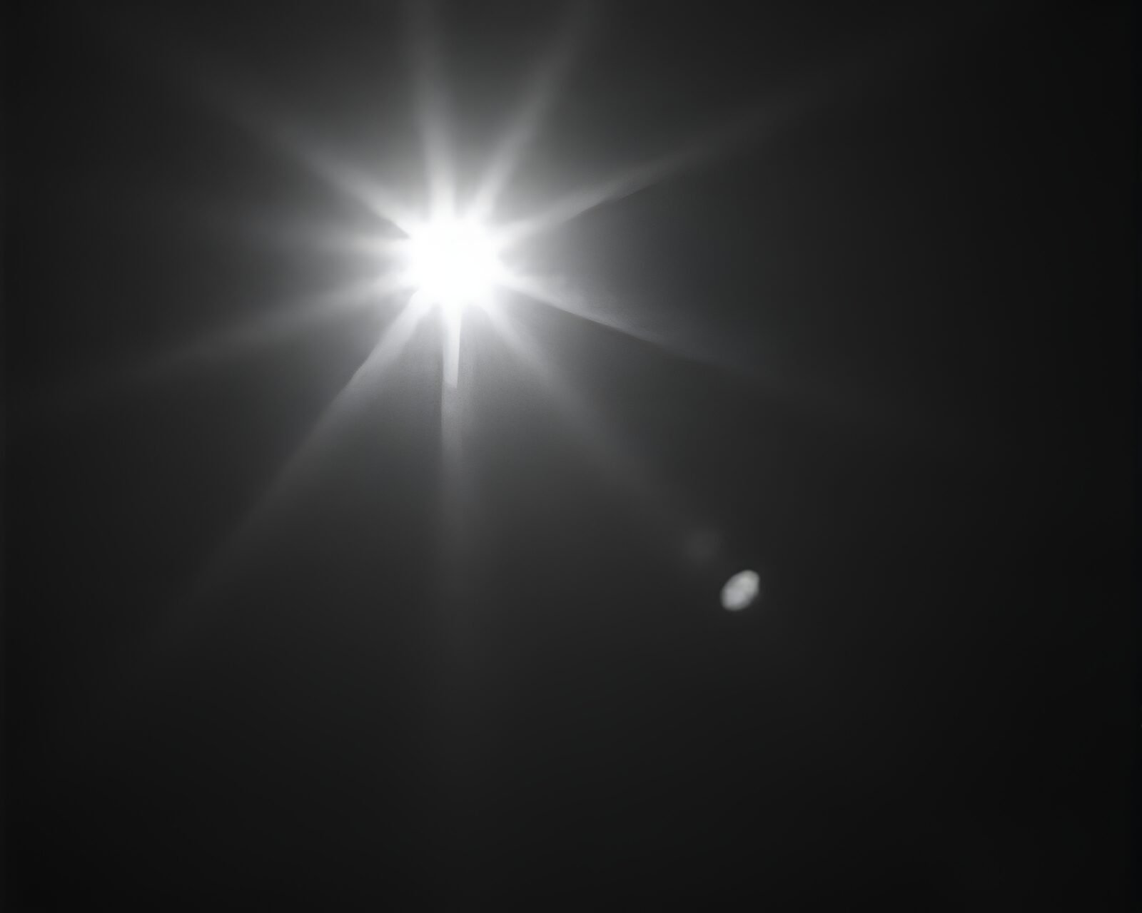 Abstract image of film burns with lunar grayscale lighting