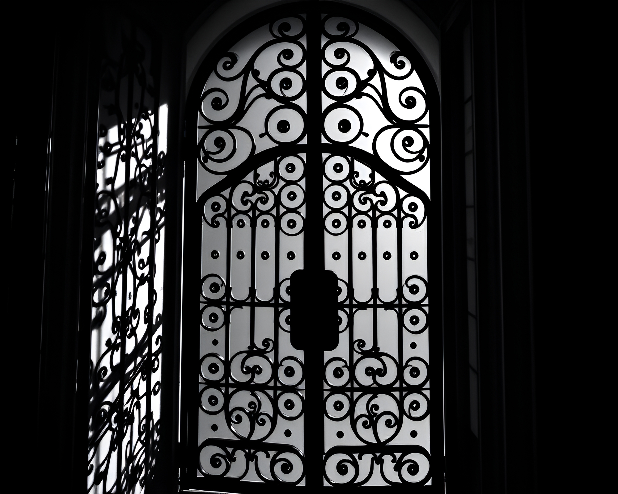 Intricate Film Noir Wrought Iron Gate Shadows – free AI stock image
