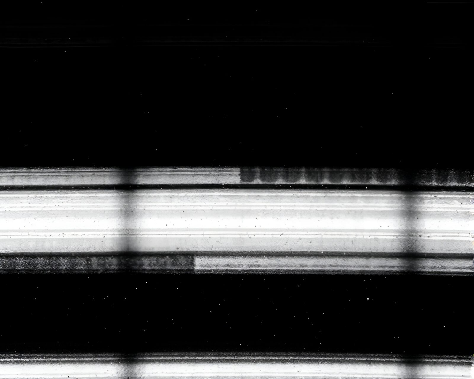 Duotone image with dust motes among intricate circuit design