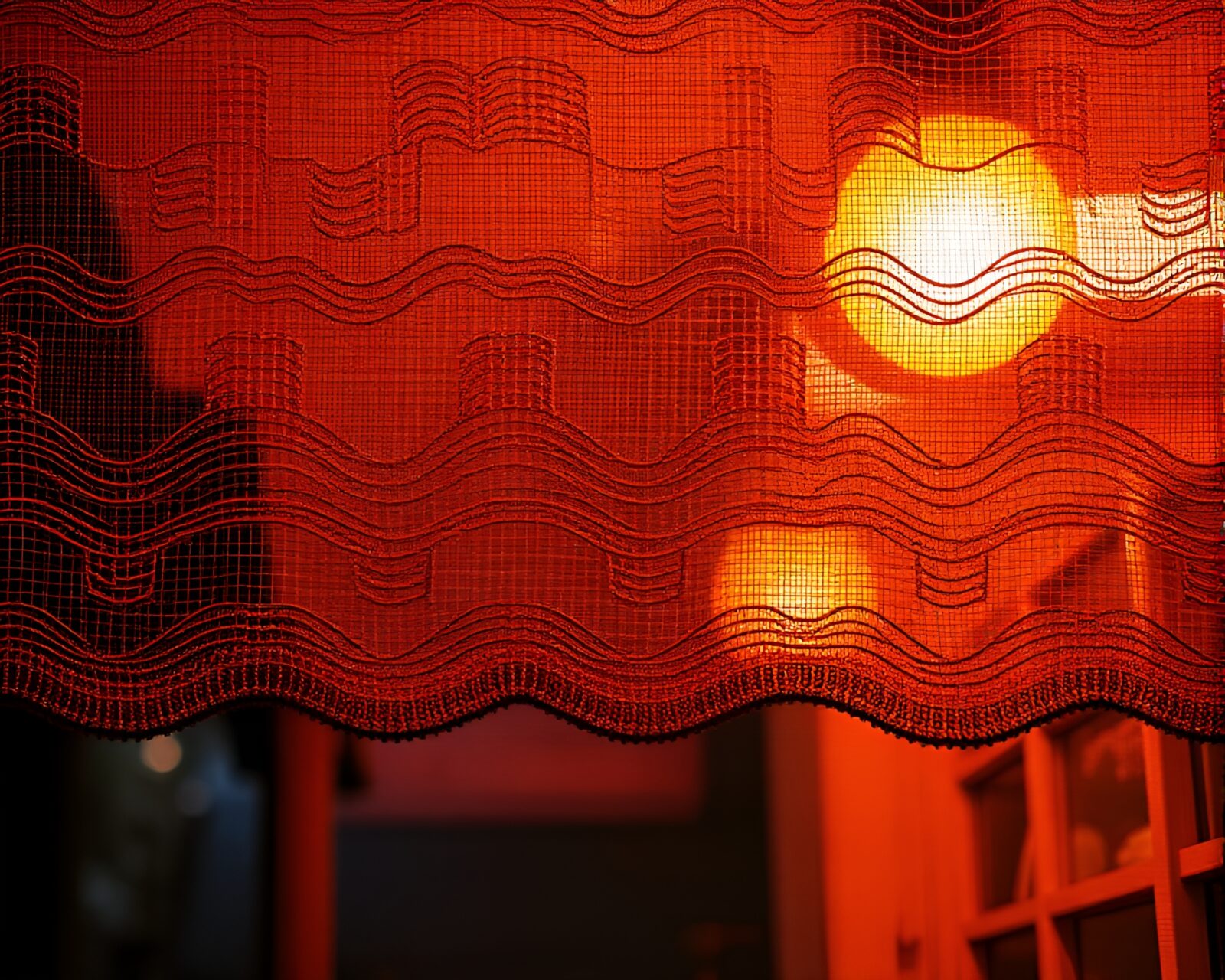 Neon-lit embroidered pattern glowing in warm porchlight
