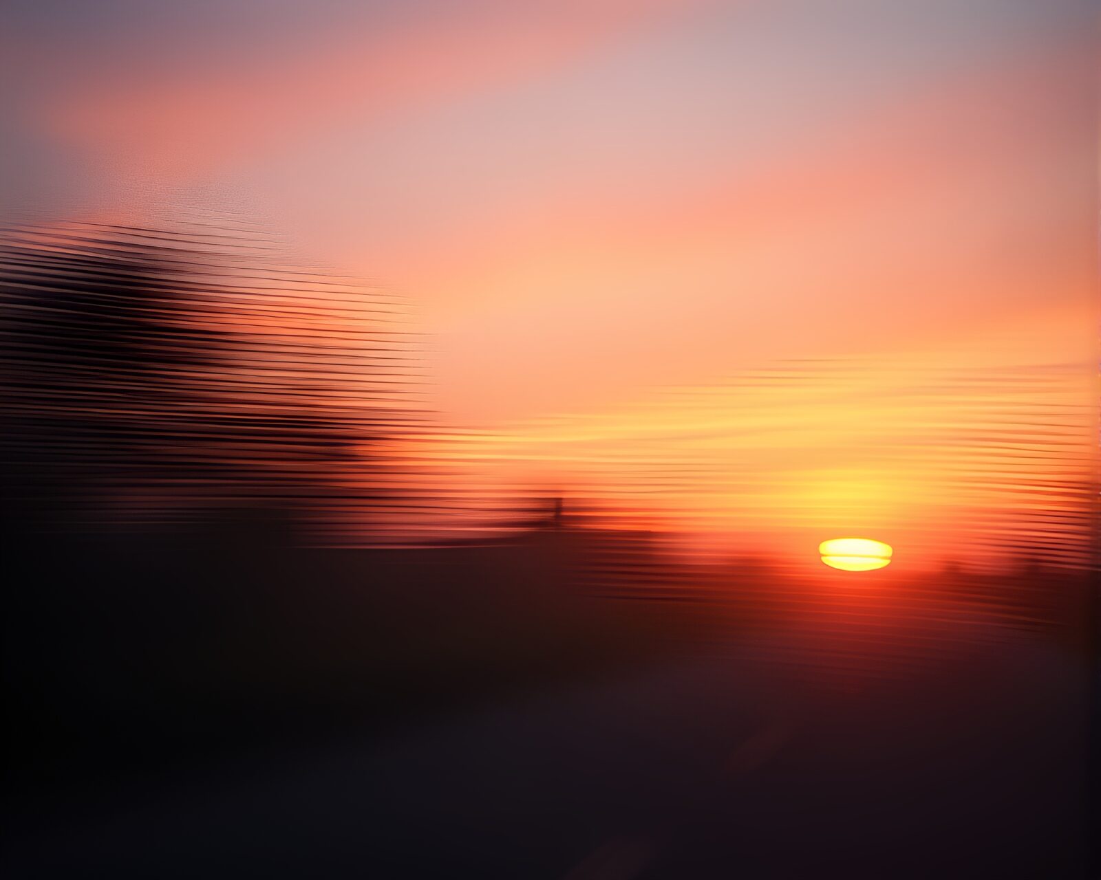 Pan motion blurred hazy sunset with vaporwave colors etched