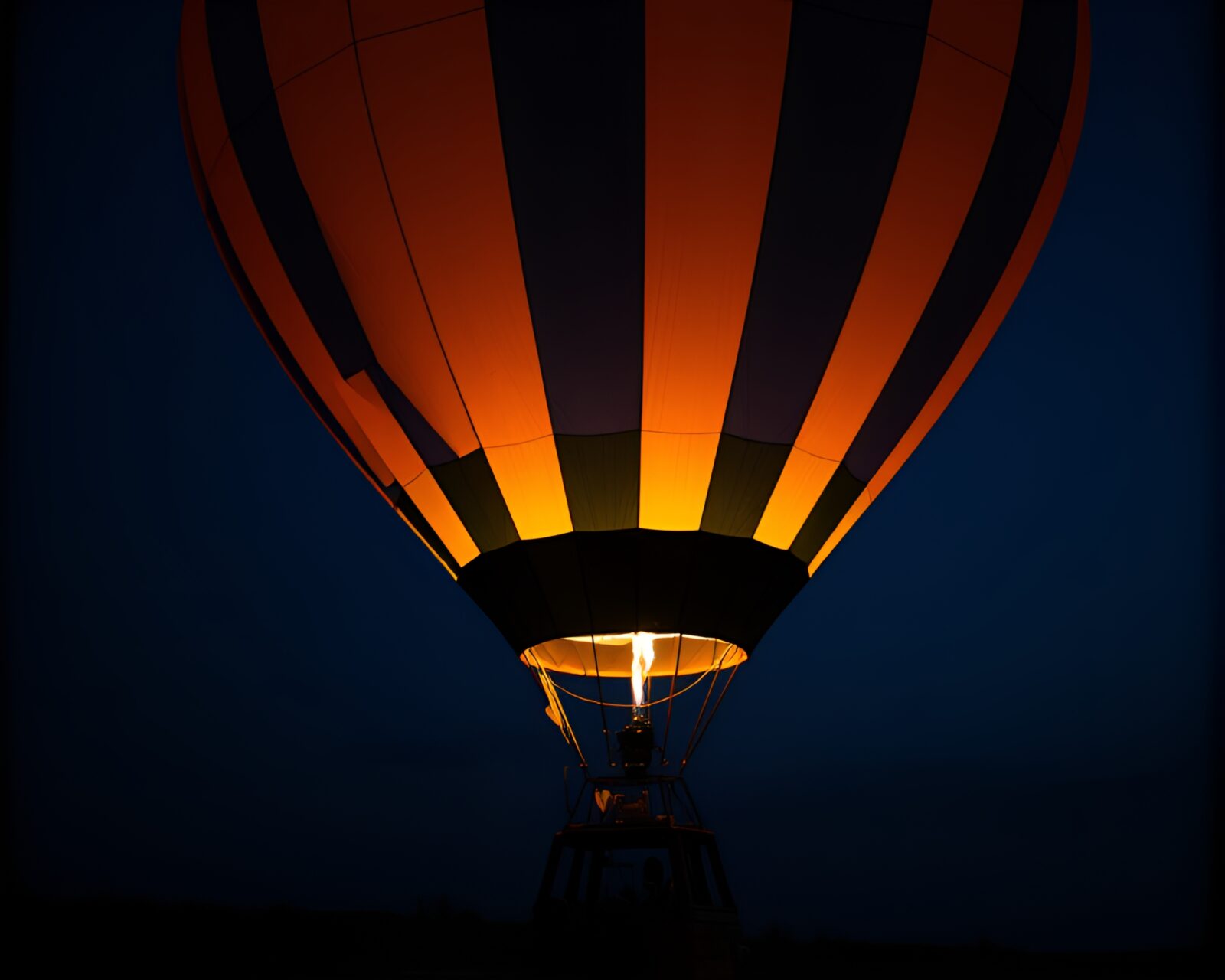 Macro photography of glowing hot air balloon with glitch artifacts