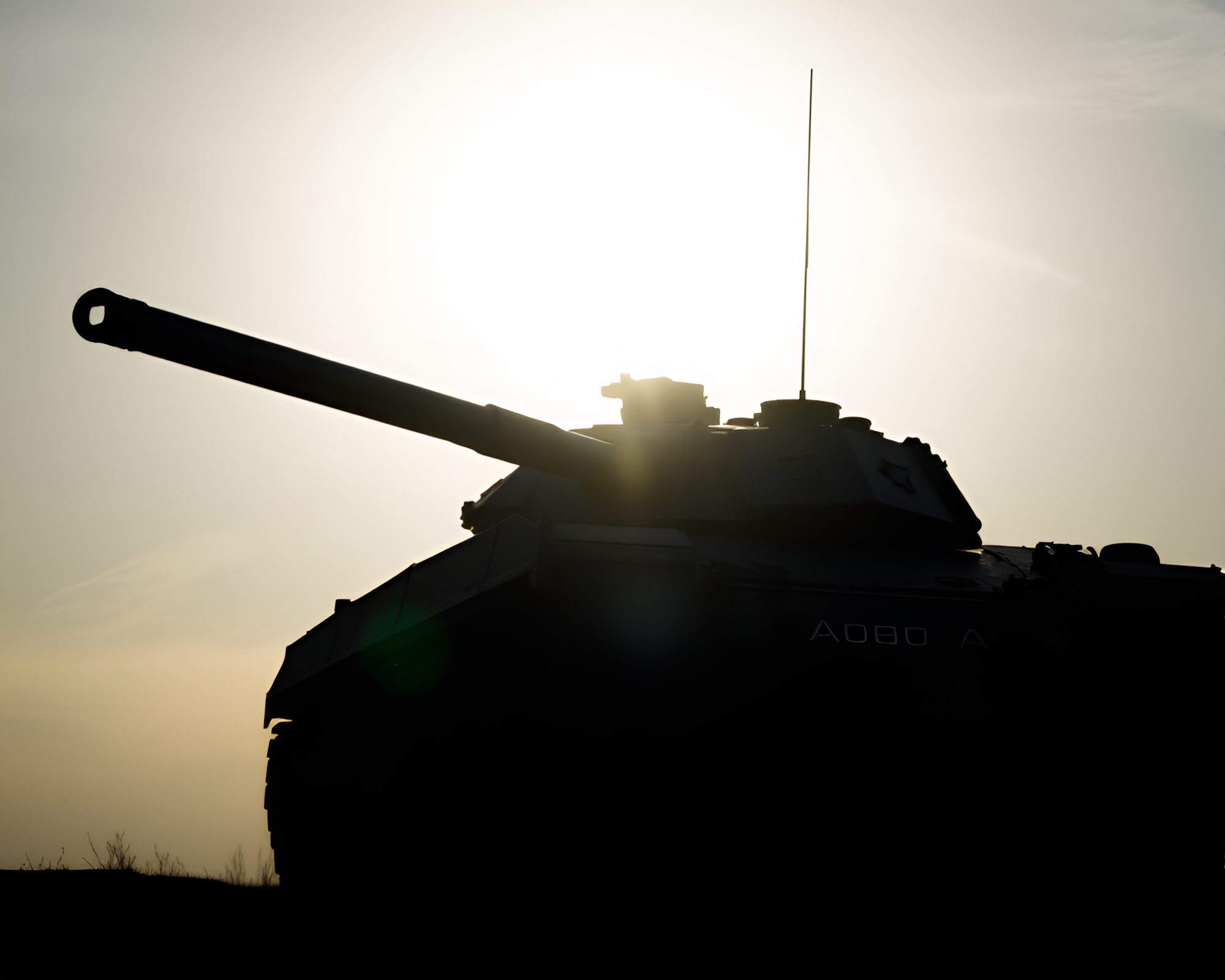 Armor Tank Silhouette in Lens Flare – free AI stock image
