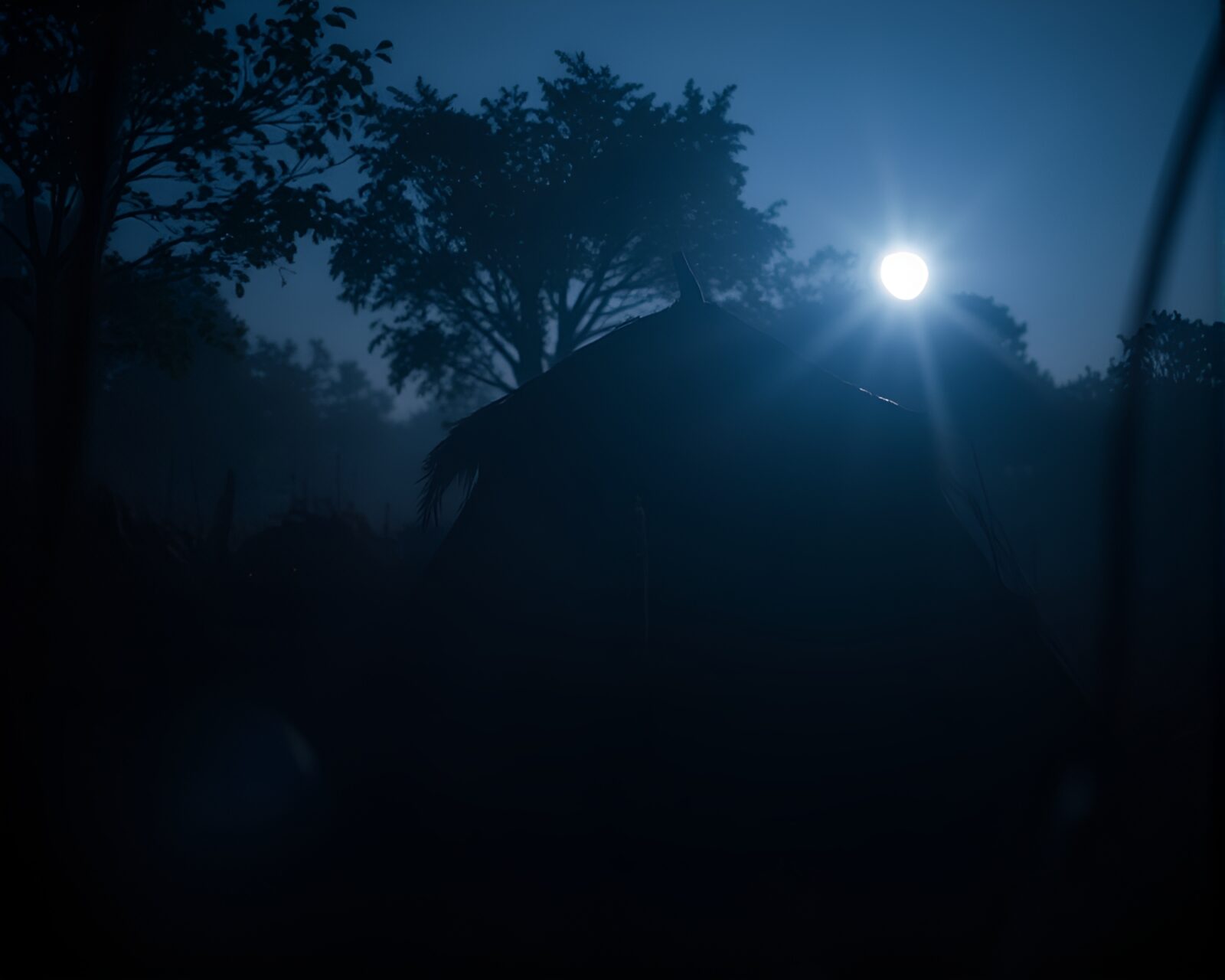Rustic mud hut illuminated by eerie CRT glow
