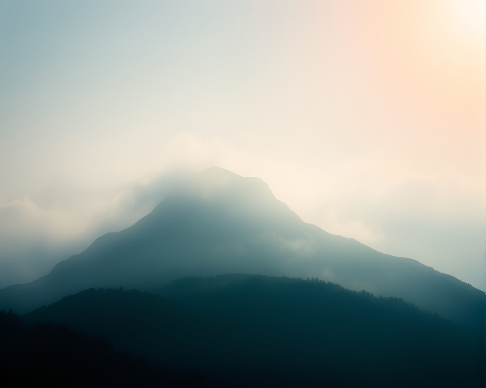 Soft and cheerful mountain peak through fast shutter speed overlay
