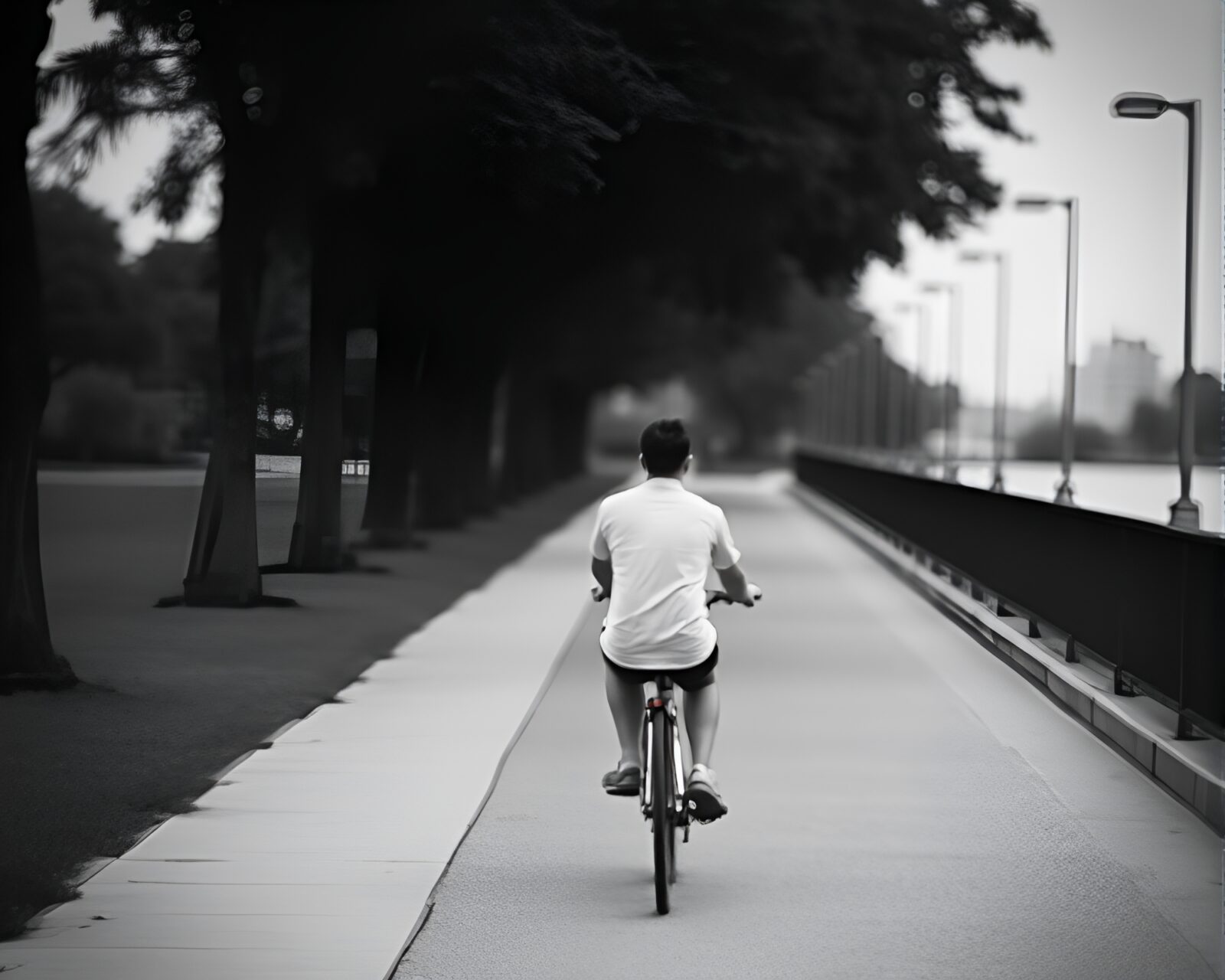 A couple riding a bicycle in a dreamy grayscale world