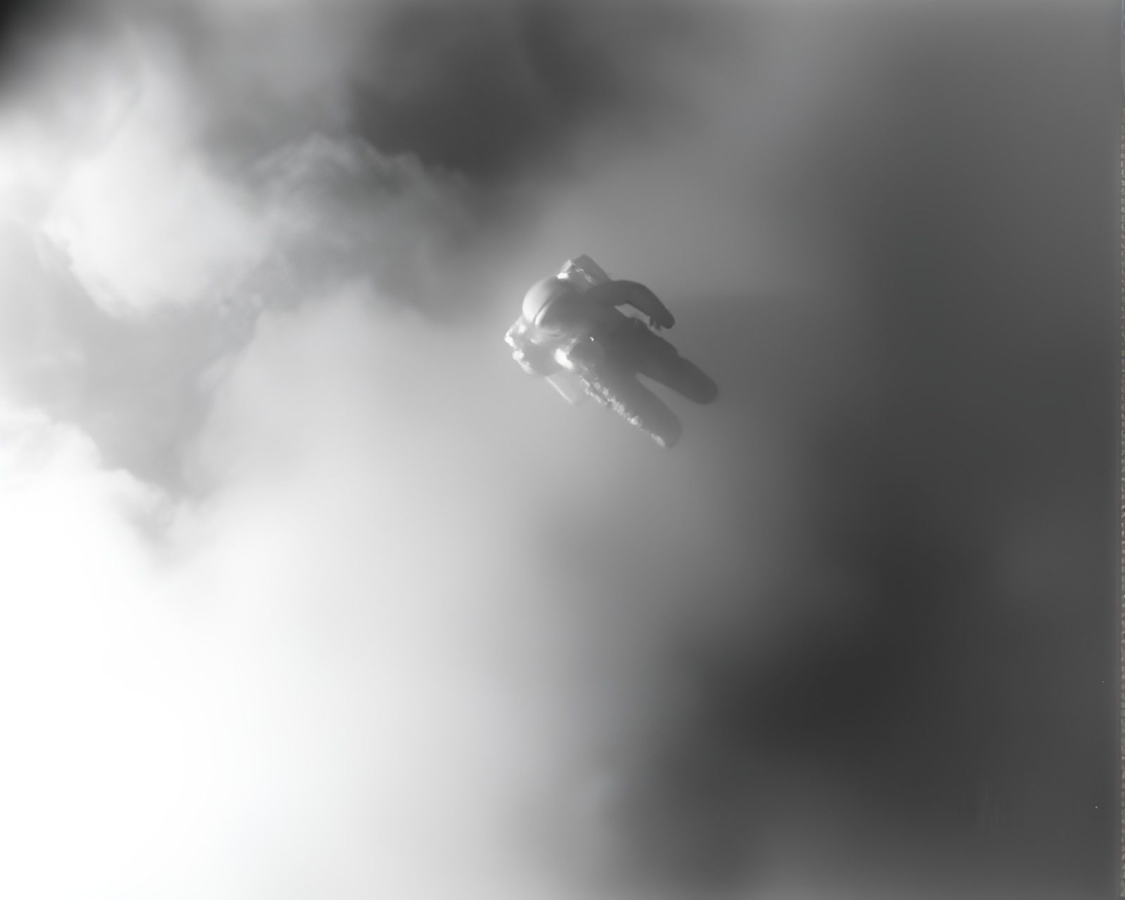 Surreal astronaut silhouette in hazy foggy atmosphere