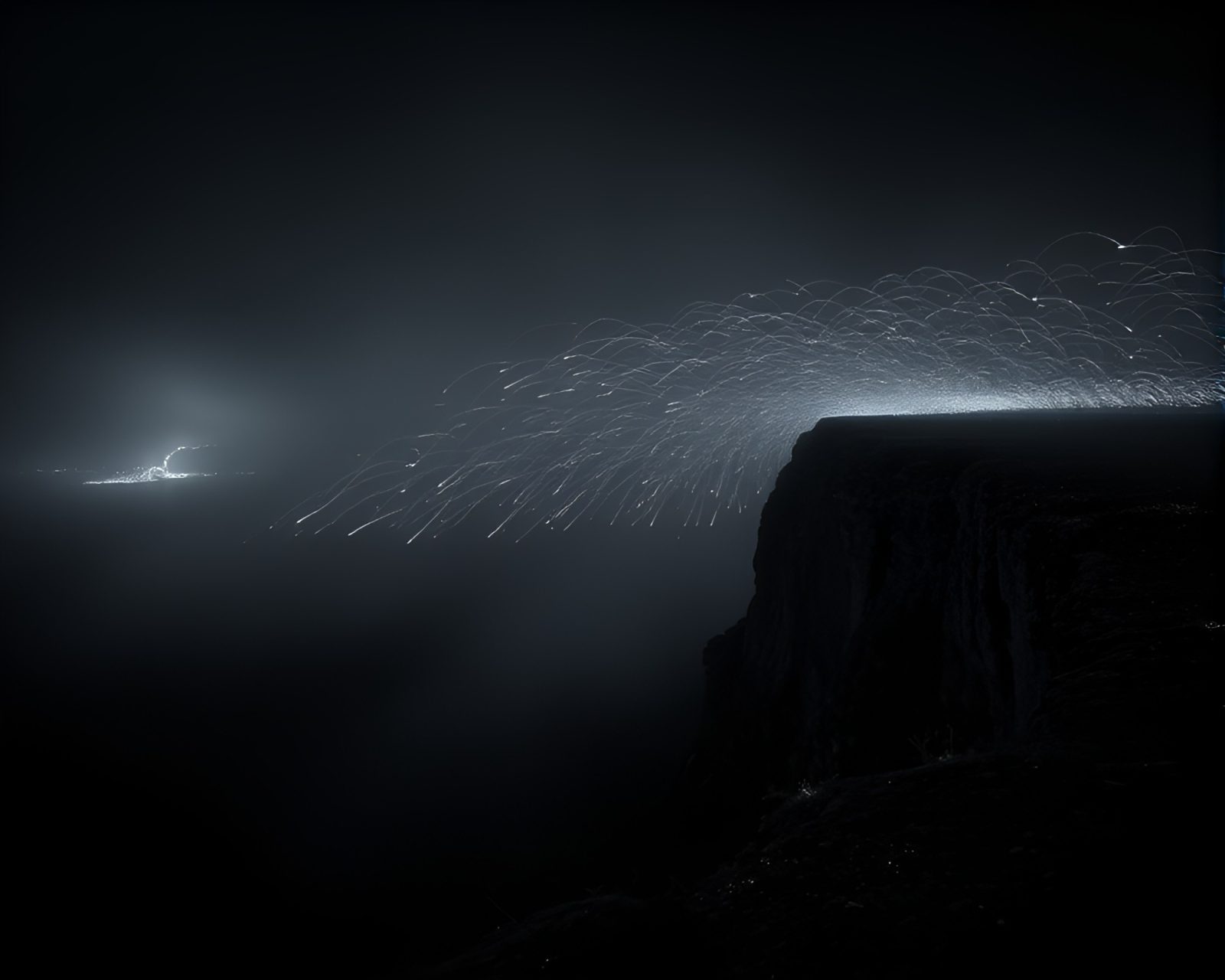 Desaturated sparkler trails cascade down misty duochrome cliffs