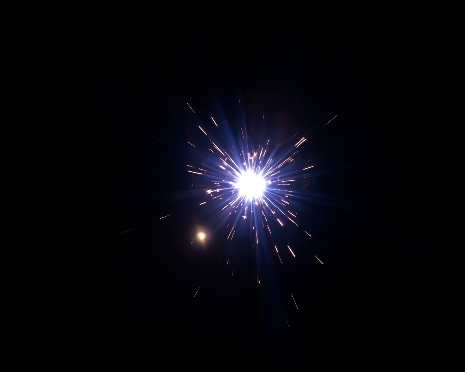 Abstract shield shape in glowing light with stardust effect