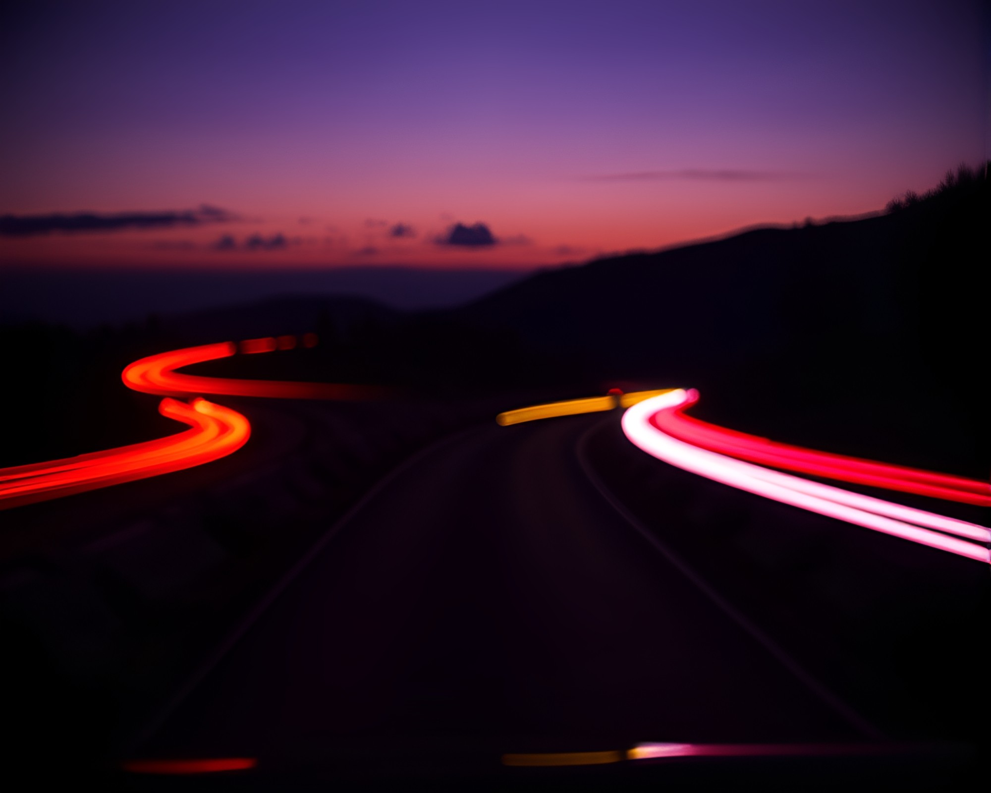 Falcon Soaring through Car Light Trails at Twilight – free AI stock image