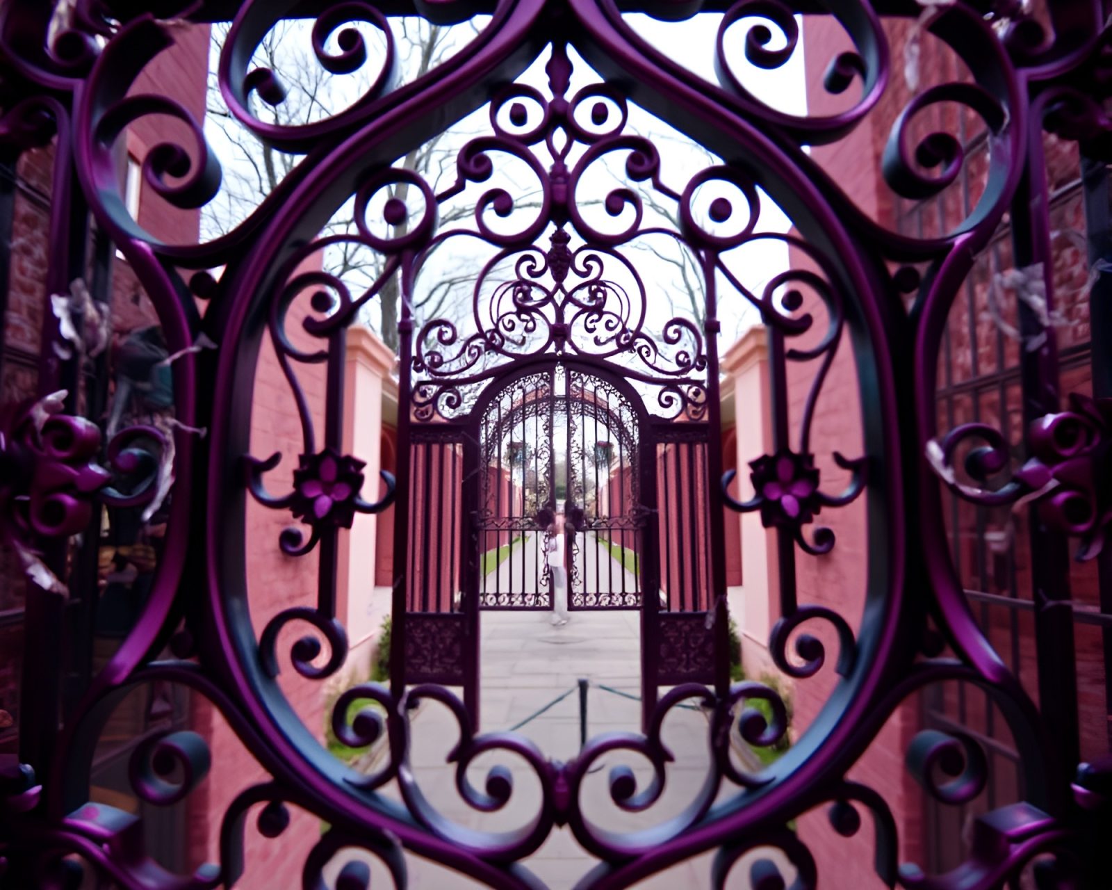 Telephoto shot of intricate iron gate in fantastical magenta hues
