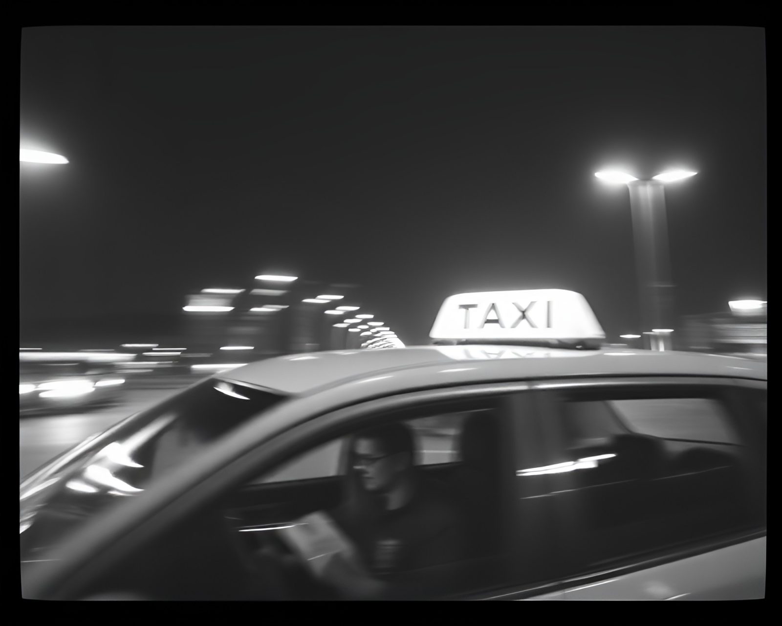 Blurred taxi streaks in duotone with film grain