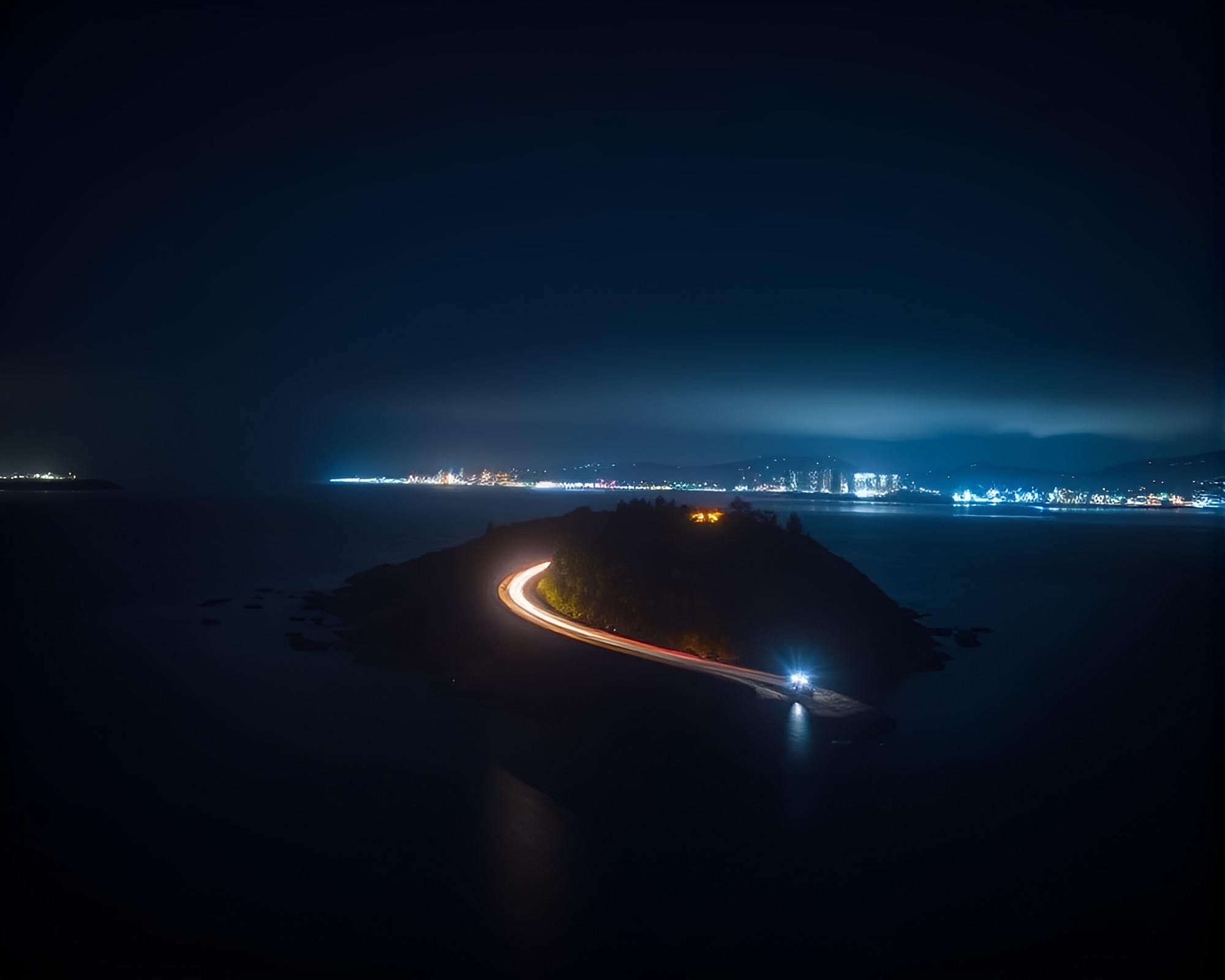 Mesmerizing Car Light Trails on Charcoal Floating Island – free AI stock image