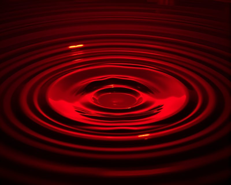 Mesmerizing Water Reflection Rings: Ruby Red Illumination – free AI stock image