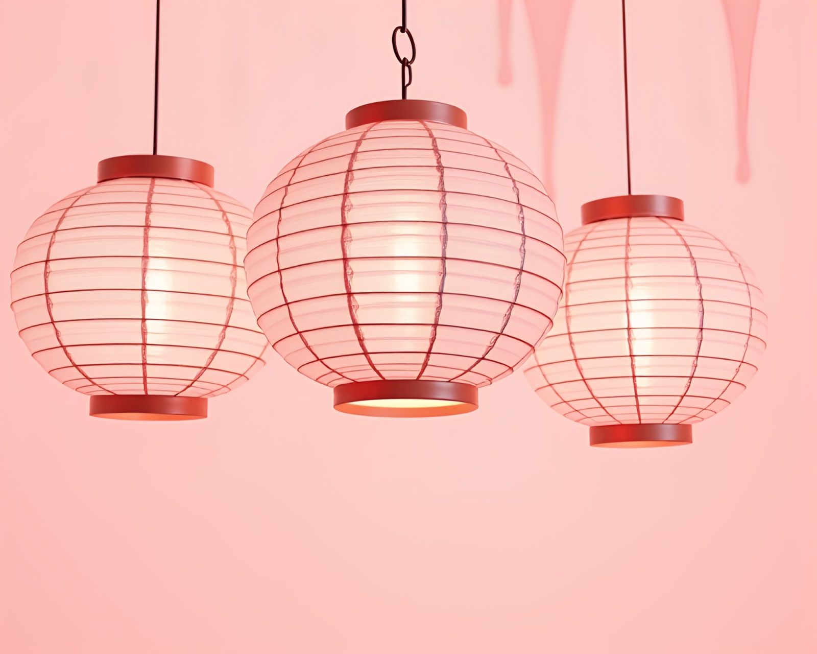 Blush pink and white paint drips surrounding delicate lanterns