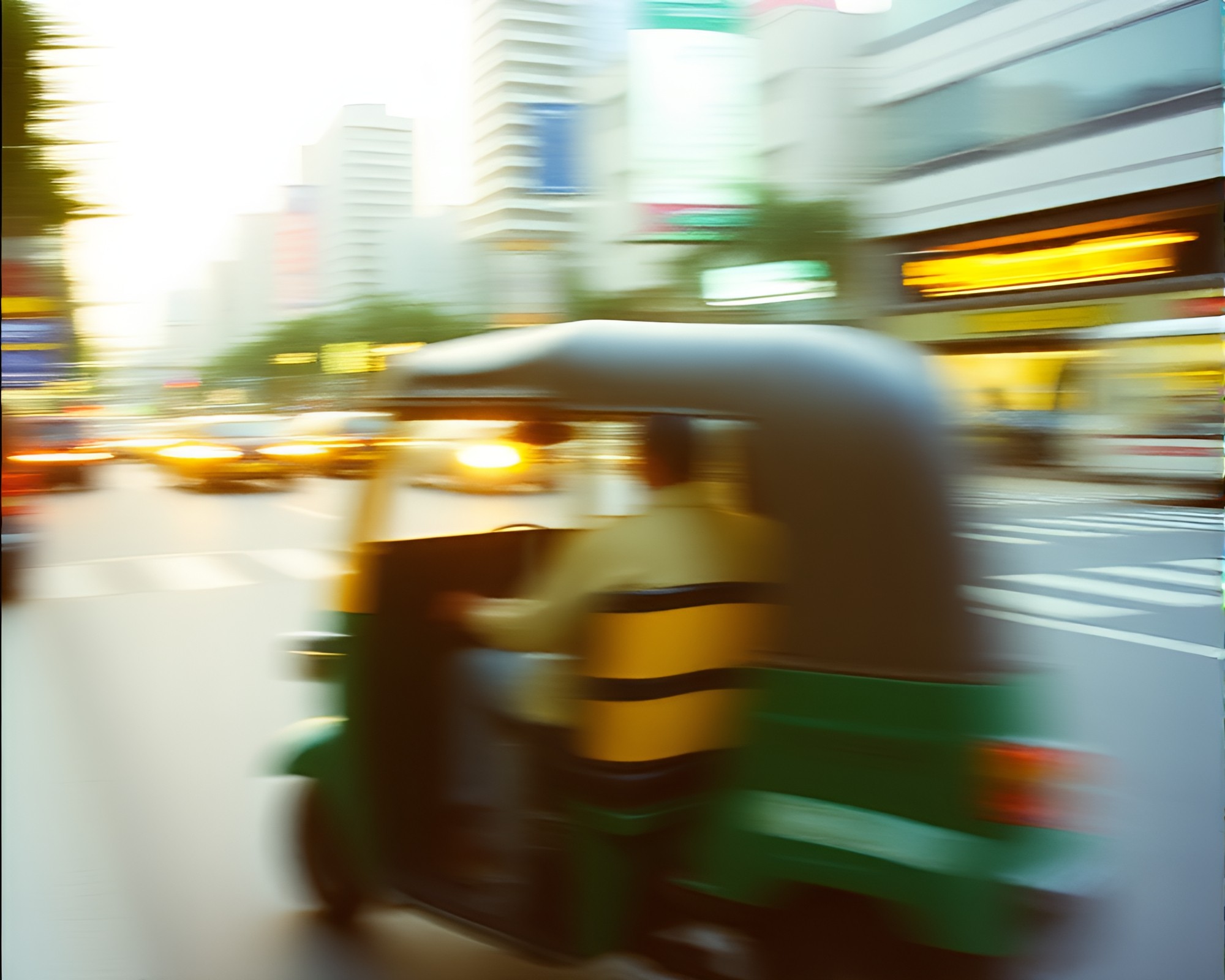 Taxi Rickshaw Streaking Through Grainy Film Streets – free AI stock image